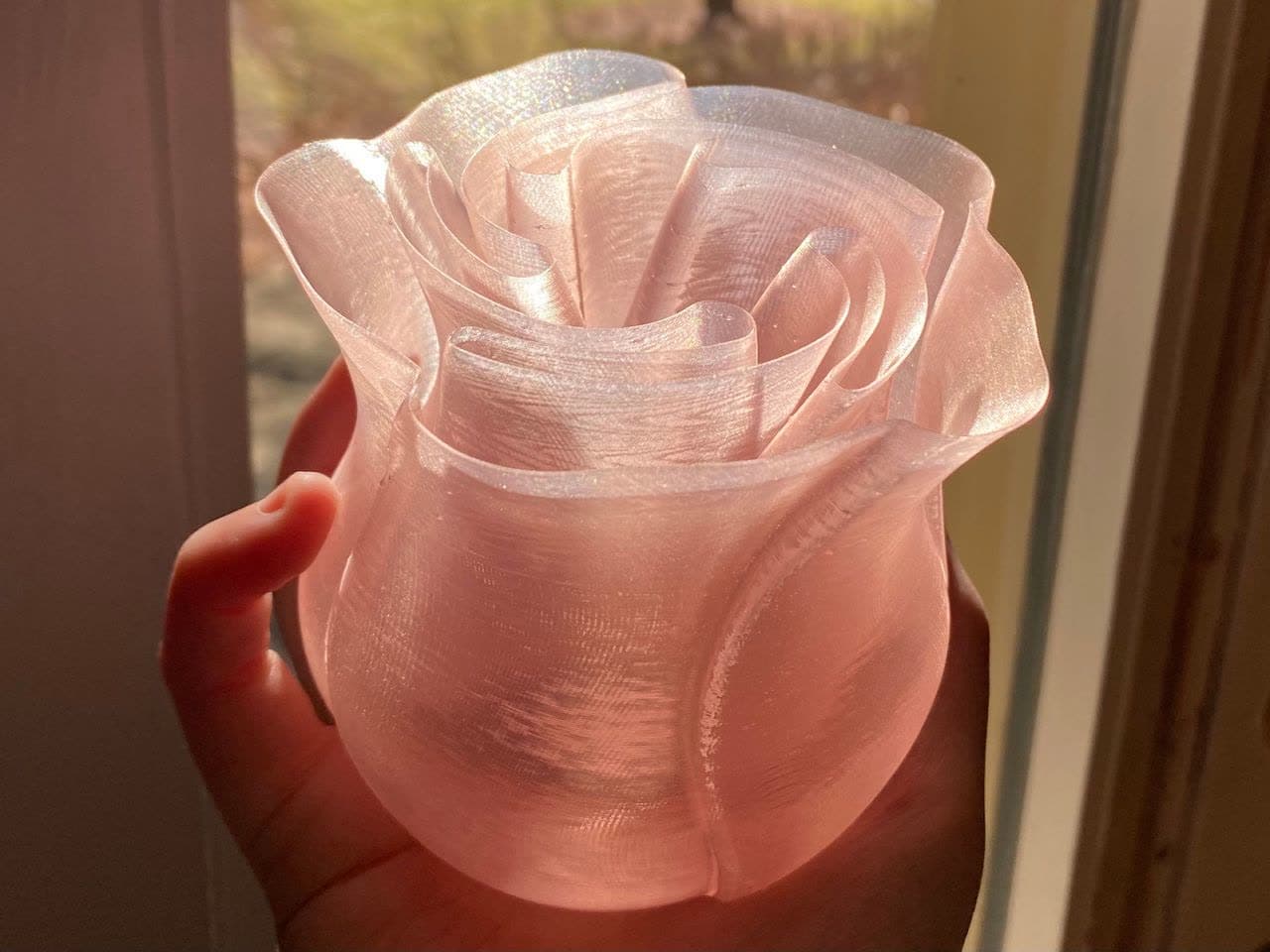 A spiral-ridged vase in pale material.